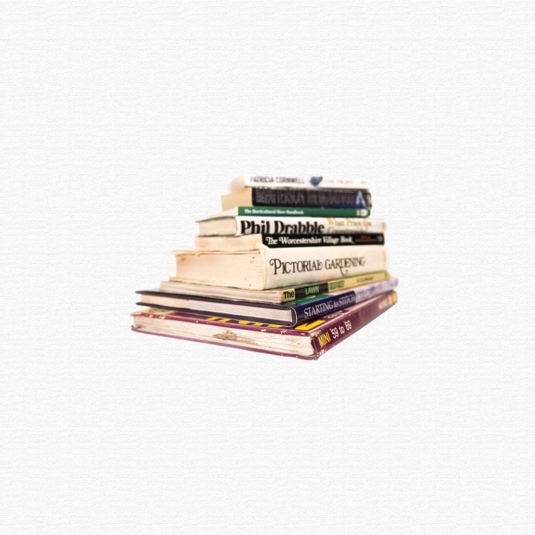 A stack of hardcover and paperback reading books