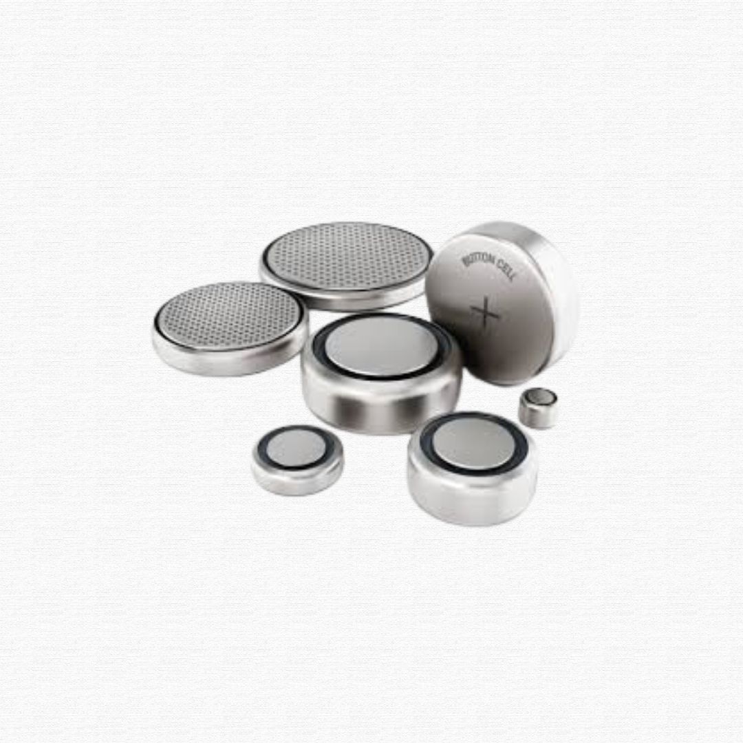 Small circular metallic coin wrist-watch scale miniature cell batteries.