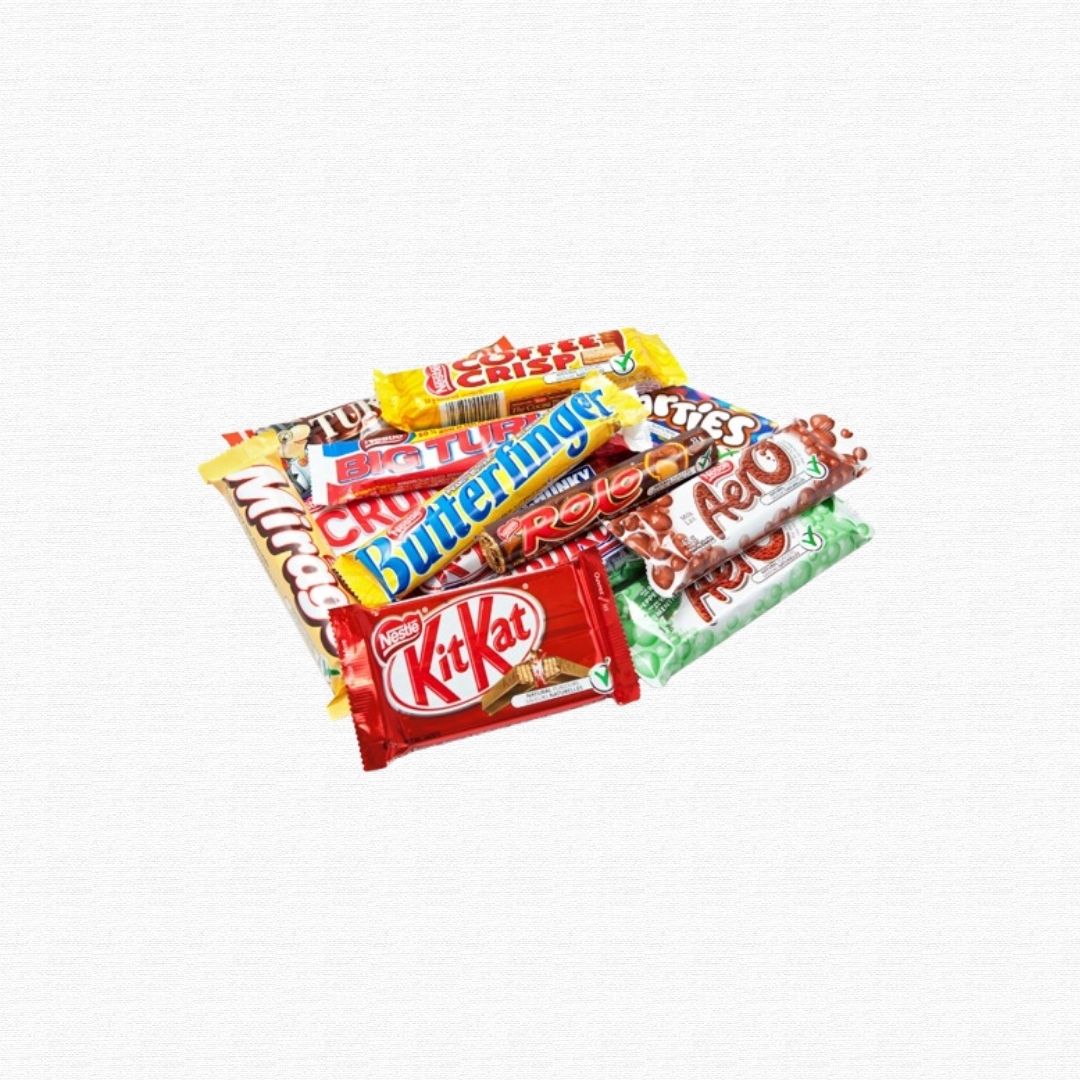 A pile of discarded empty candy and chocolate wrappers