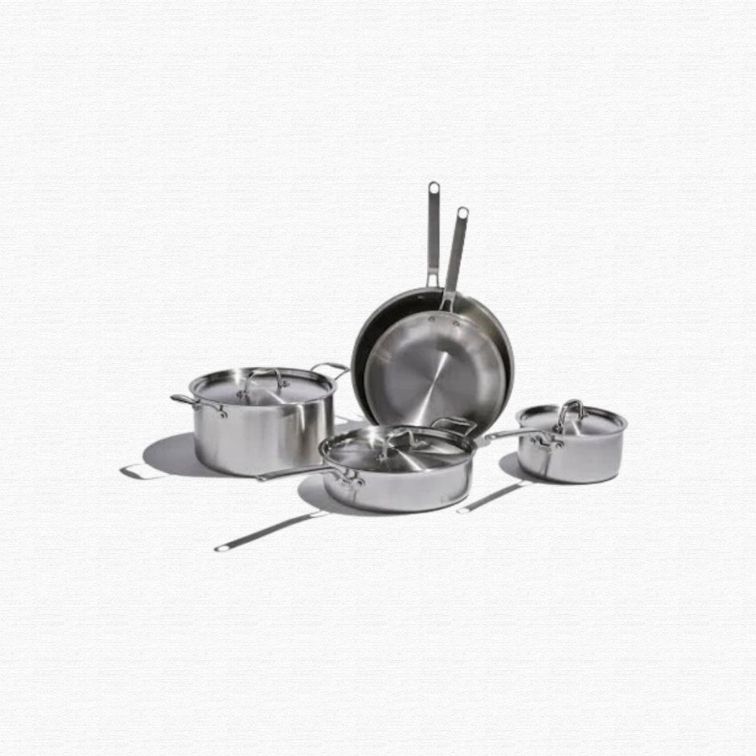 Worn kitchen metal frying pans and steel baking cookie sheets.