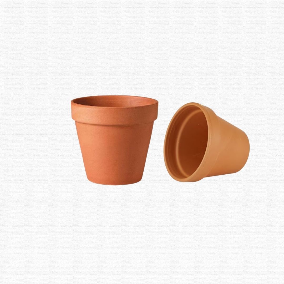 Stacked terracotta and ceramic planter pots.