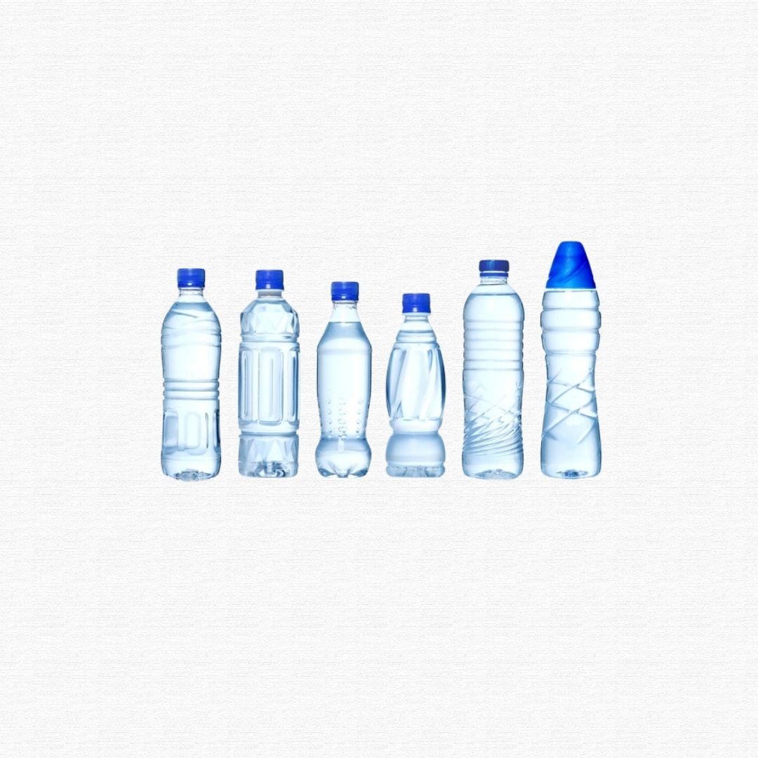 Clear plastic single-use water and soda drink bottles