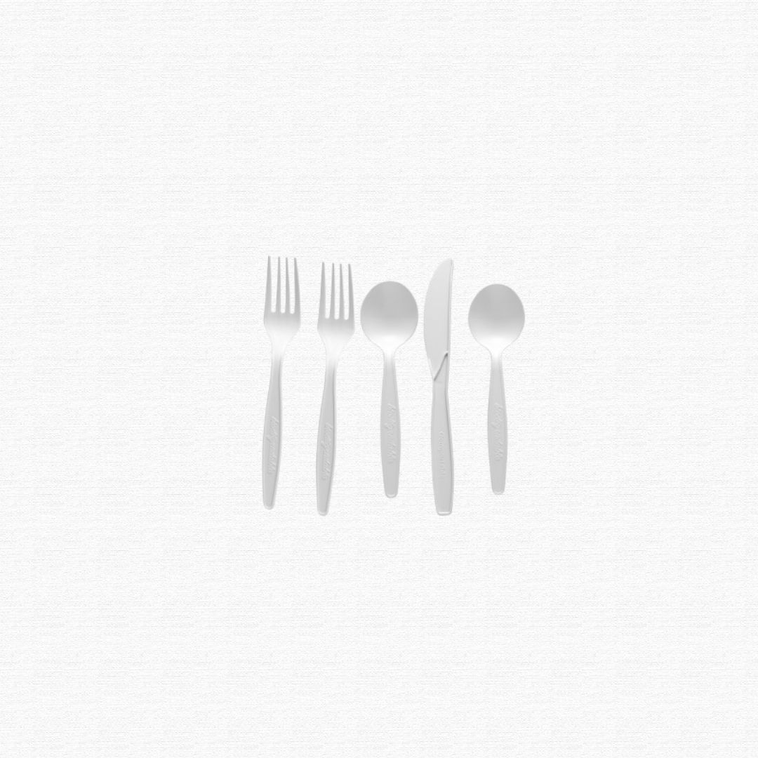 Single-use white plastic forks, knives, and spoons