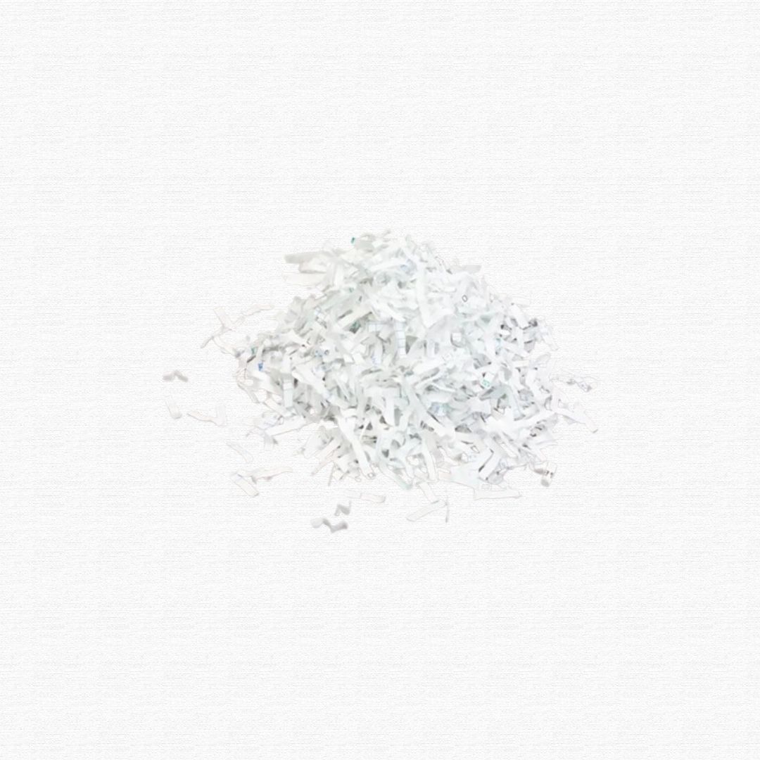 A pile of white document paper shredded into narrow strips