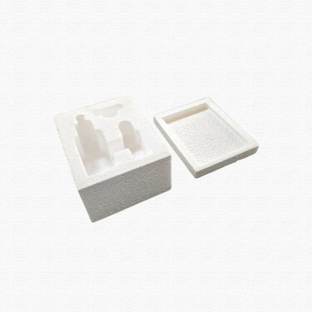 Molded white styrofoam packaging inserts from an electronics box